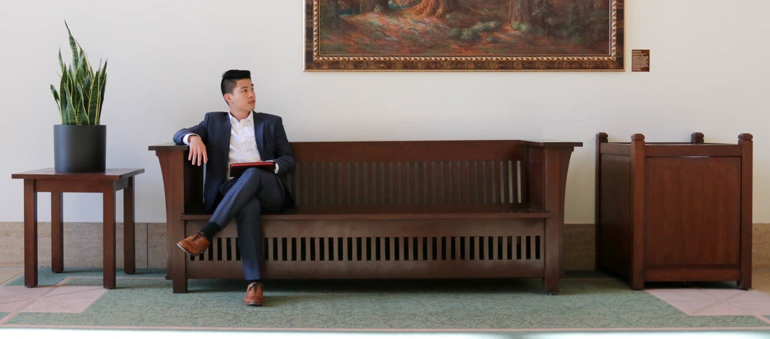 jim nguyen sitting on a bench.